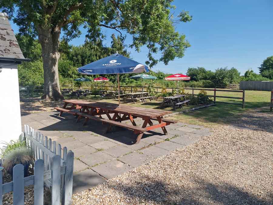 The pretty relaxing garden at the Old Ox Inn Shillingstone Blandford Forum Dorset where you can enjoy a meal or a drink or both in the sunshine